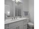 Modern bathroom with white vanity and a large mirror at 8400 E Columbus Ave, Scottsdale, AZ 85251