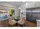 Breakfast nook with glass table and seating, overlooking the backyard at 8400 E Columbus Ave, Scottsdale, AZ 85251