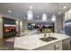 Open concept kitchen with large island and breakfast bar at 8400 E Columbus Ave, Scottsdale, AZ 85251