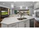 Large kitchen island with double sink and breakfast bar seating at 8400 E Columbus Ave, Scottsdale, AZ 85251