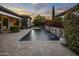 Resort-style pool with water features and stonework at 8400 E Columbus Ave, Scottsdale, AZ 85251