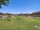 Community playground with shade structure and grassy area at 8656 W Warner St, Tolleson, AZ 85353