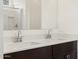 Bright bathroom featuring double sinks and a view to the large walk-in shower at 9108 N 174Th Ln, Waddell, AZ 85355