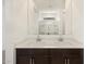 Bright bathroom featuring double sinks and a view to the large walk-in shower at 9108 N 174Th Ln, Waddell, AZ 85355