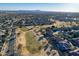 Aerial view of a residential area adjacent to a golf course at 9754 E Natal Ave, Mesa, AZ 85209