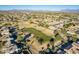 Aerial view showcasing a neighborhood's golf course and homes at 9754 E Natal Ave, Mesa, AZ 85209