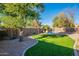 Landscaped backyard oasis featuring a refreshing pool at 9754 E Natal Ave, Mesa, AZ 85209