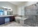 Elegant bathroom with a soaking tub and walk-in shower at 9754 E Natal Ave, Mesa, AZ 85209