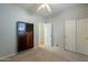 Bedroom with built-in media console and double doors at 9754 E Natal Ave, Mesa, AZ 85209