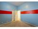 Spacious bedroom with light blue walls and red accents at 9754 E Natal Ave, Mesa, AZ 85209