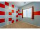 Bedroom with red and blue checkered walls and window blinds at 9754 E Natal Ave, Mesa, AZ 85209