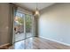 Breakfast nook with wood floors and sliding glass doors to patio at 9754 E Natal Ave, Mesa, AZ 85209