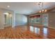 Bright dining room with hardwood floors and access to backyard at 9754 E Natal Ave, Mesa, AZ 85209