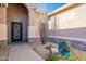 Elegant entryway with an ornate iron door and stone accents at 9754 E Natal Ave, Mesa, AZ 85209