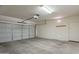 Attached garage with overhead door and ample space for parking and storage at 9754 E Natal Ave, Mesa, AZ 85209