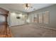 Gathering room with carpet, built-in shelving, and large windows at 9754 E Natal Ave, Mesa, AZ 85209