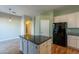 Kitchen island with granite countertops and hardwood floors at 9754 E Natal Ave, Mesa, AZ 85209