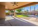 Spacious covered patio overlooking the backyard and pool at 9754 E Natal Ave, Mesa, AZ 85209