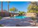 Relaxing kidney-shaped pool with flagstone decking at 9754 E Natal Ave, Mesa, AZ 85209