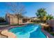 Inviting kidney-shaped pool surrounded by a flagstone patio at 9754 E Natal Ave, Mesa, AZ 85209