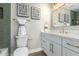 Stylish bathroom featuring a double vanity and green tile at 10896 E Sahuaro Dr, Scottsdale, AZ 85259