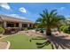 Landscaped backyard with putting green and pool at 10902 E Silver Mine Rd, Gold Canyon, AZ 85118