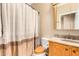 Bathroom with a shower/tub combo and wood vanity at 10902 E Silver Mine Rd, Gold Canyon, AZ 85118