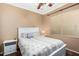 Charming bedroom with a white bed frame and patterned bedding at 10902 E Silver Mine Rd, Gold Canyon, AZ 85118
