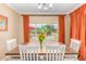 Bright dining room with wood table and chairs, pool view at 10902 E Silver Mine Rd, Gold Canyon, AZ 85118
