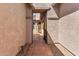 Courtyard entry with tile flooring and wrought-iron gate at 10902 E Silver Mine Rd, Gold Canyon, AZ 85118