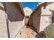 Courtyard entry with tile flooring and wrought-iron gate at 10902 E Silver Mine Rd, Gold Canyon, AZ 85118