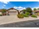 Single-story home with desert landscaping and two-car garage at 10902 E Silver Mine Rd, Gold Canyon, AZ 85118