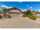 Single-story home with desert landscaping and two-car garage at 10902 E Silver Mine Rd, Gold Canyon, AZ 85118