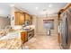 Kitchen with granite counters, stainless steel appliances, and wood cabinets at 10902 E Silver Mine Rd, Gold Canyon, AZ 85118