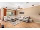 Spacious living room featuring a large sectional sofa and tile floors at 10902 E Silver Mine Rd, Gold Canyon, AZ 85118