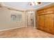 Bright office space with tile floors and built-in cabinet at 10902 E Silver Mine Rd, Gold Canyon, AZ 85118