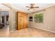 Bright office space with tile floors and built-in cabinet at 10902 E Silver Mine Rd, Gold Canyon, AZ 85118