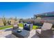 Artificial turf backyard with seating area and fire pit at 12387 E Black Rock Rd, Scottsdale, AZ 85255