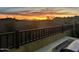 Desert backyard view featuring a gorgeous orange sunrise over the mountains from the outdoor patio at 12387 E Black Rock Rd, Scottsdale, AZ 85255