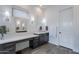 Modern bathroom with double vanity and large mirror at 12387 E Black Rock Rd, Scottsdale, AZ 85255