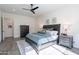 Spacious bedroom with wood-like flooring and large windows at 12387 E Black Rock Rd, Scottsdale, AZ 85255