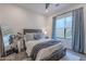 Cozy bedroom with full-size bed and built-in storage at 12387 E Black Rock Rd, Scottsdale, AZ 85255