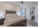 Bright bedroom with ensuite access and dark wood furniture at 12387 E Black Rock Rd, Scottsdale, AZ 85255