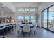 Bright dining area with a round table and chairs, an open floor plan, and access to a patio at 12387 E Black Rock Rd, Scottsdale, AZ 85255