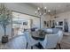Open concept dining area with a view of the backyard patio and living room at 12387 E Black Rock Rd, Scottsdale, AZ 85255