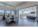 Spacious dining area with sliding doors leading to a large patio and outdoor kitchen at 12387 E Black Rock Rd, Scottsdale, AZ 85255