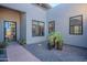 Inviting front entry with courtyard and drought-tolerant plants at 12387 E Black Rock Rd, Scottsdale, AZ 85255