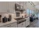 Modern kitchen with stainless steel appliances and white shaker cabinets at 12387 E Black Rock Rd, Scottsdale, AZ 85255