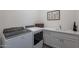 Laundry room with Whirlpool washer and dryer set at 12387 E Black Rock Rd, Scottsdale, AZ 85255