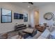 Comfortable living room with large TV and ample seating at 12387 E Black Rock Rd, Scottsdale, AZ 85255
